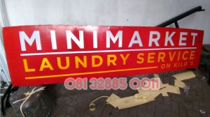 papan nama minimarket kudus
